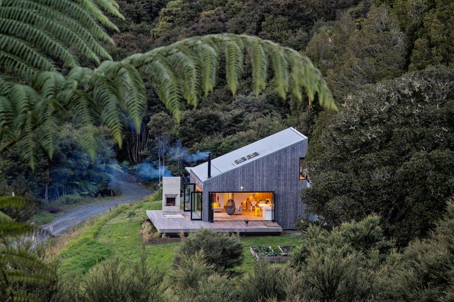 House among native bush, Pūhoi